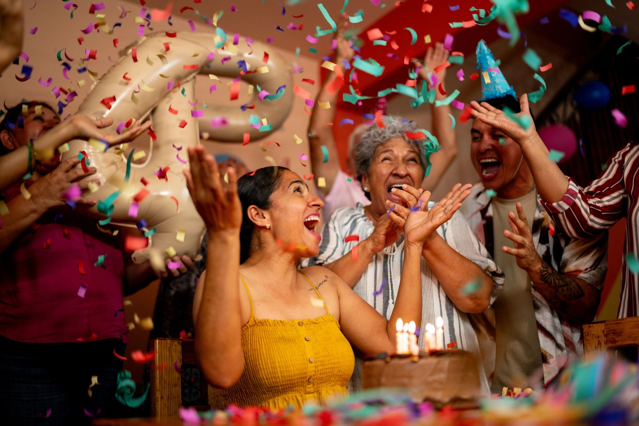 Woman celebrating a birthday with family at home