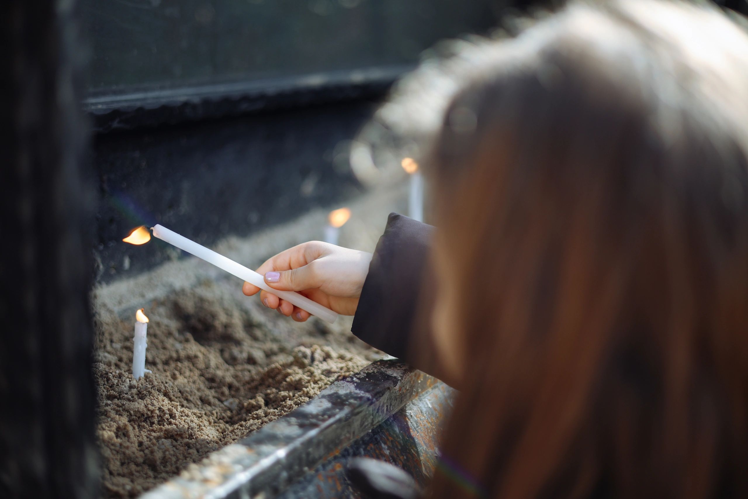 Candle held in a church setting