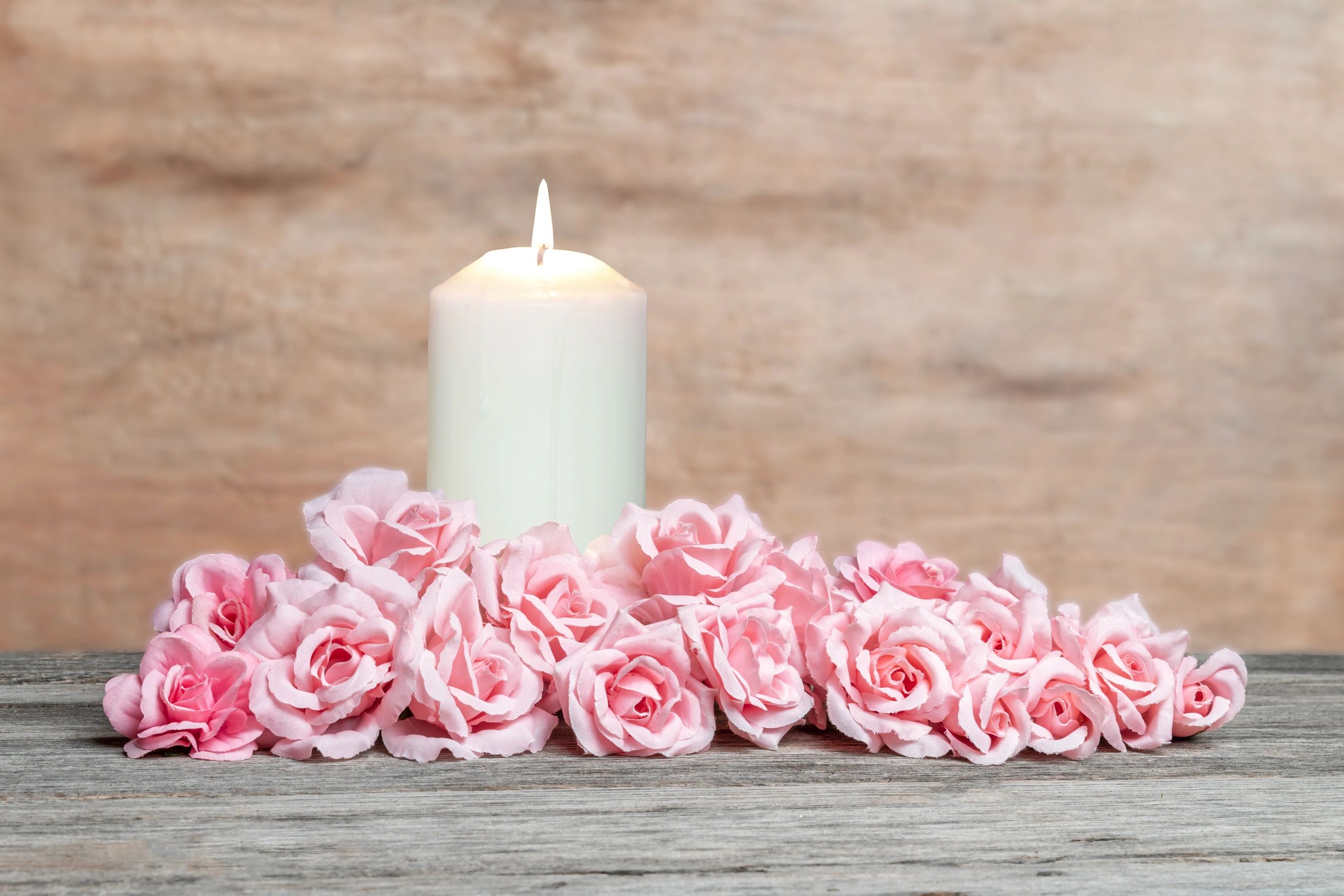 Candle and flowers arranged for remembrance